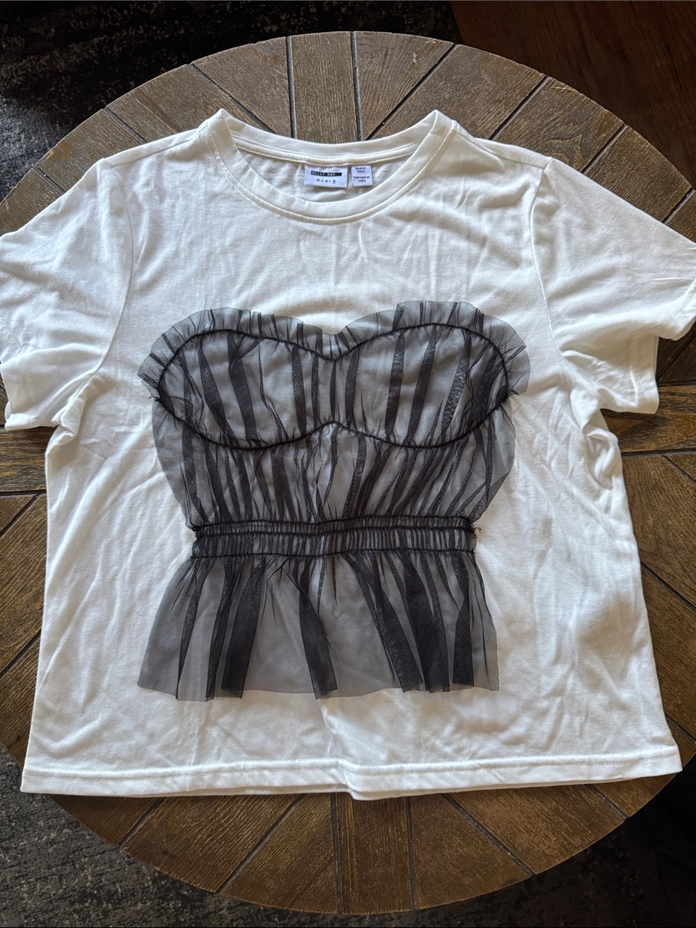 Noisy may White Tee with Black Sheer Bust Overlay